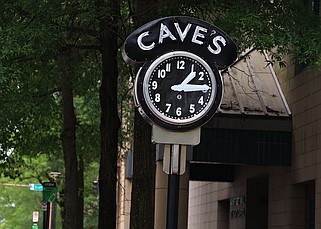 The iconic Cave’s Clock on the corner of Main and Capitol streets in Little Rock, shown Wednesday May 8, 2024, is now whole again. A crew from a Hot Springs clock repair company put the  faces back on the clock Tuesday night. (Arkansas Democrat-Gazette/Staton Breidenthal).
